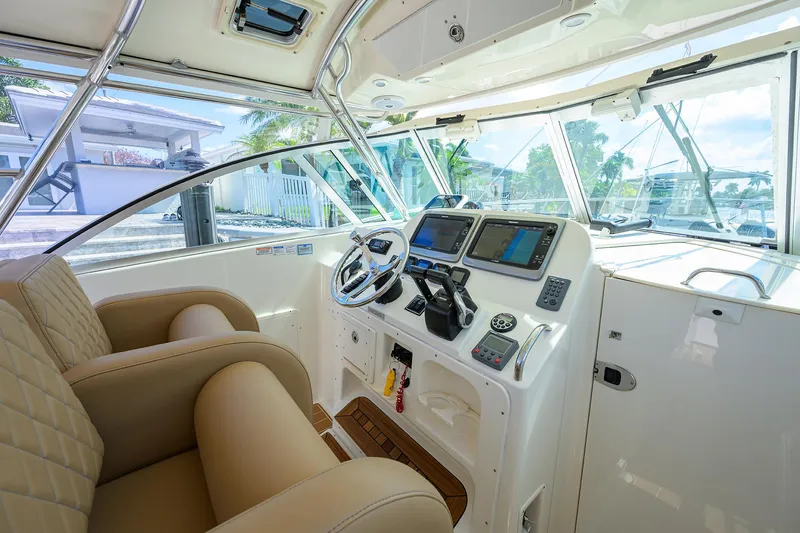 Slide: The Image of Pursuit 34 Nauti-Hooker - Helm Seating and Controls - 2