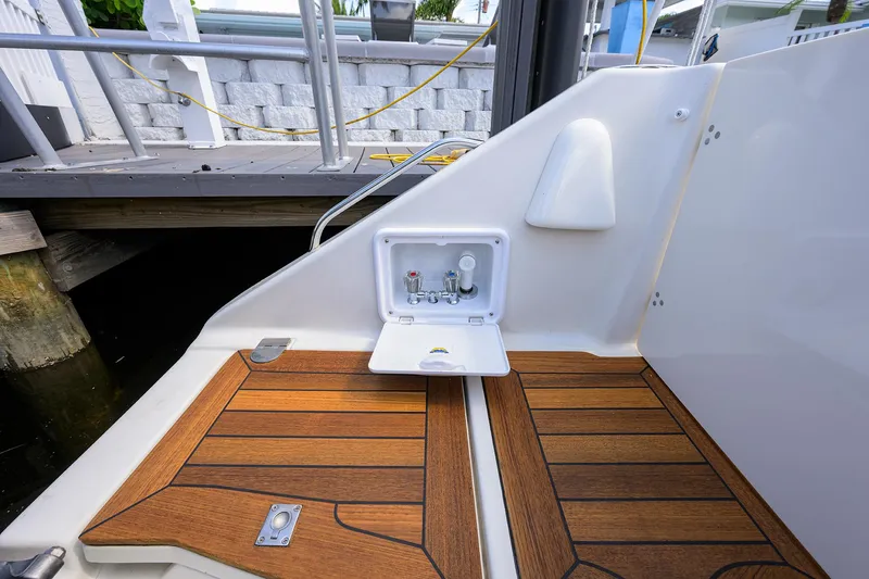 Slide: The Image of Pursuit 34 Nauti-Hooker - Transom - 39