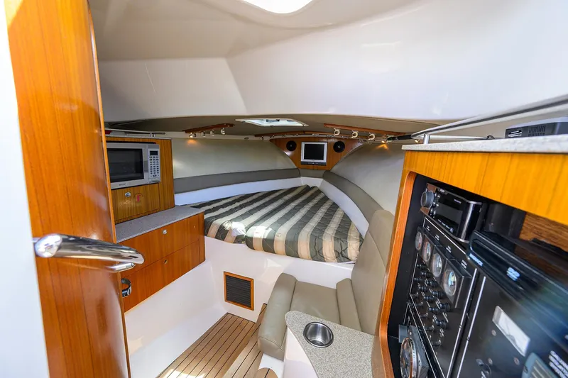 Slide: The Image of Pursuit 34 Nauti-Hooker - Forward Berth - 6