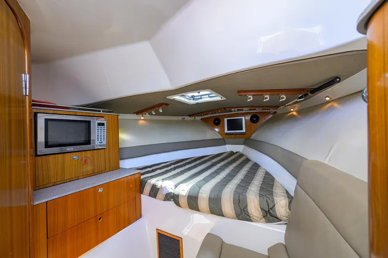 Slide: The Image of Pursuit 34 Nauti-Hooker - Forward Berth - 7