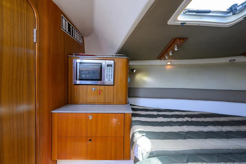 Slide: The Image of Pursuit 34 Nauti-Hooker - Forward Berth - 8