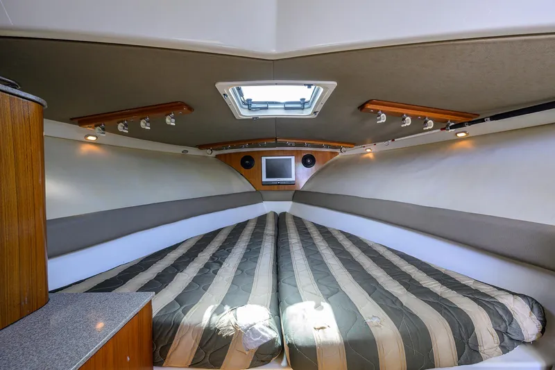 Slide: The Image of Pursuit 34 Nauti-Hooker - Forward Berth - 9