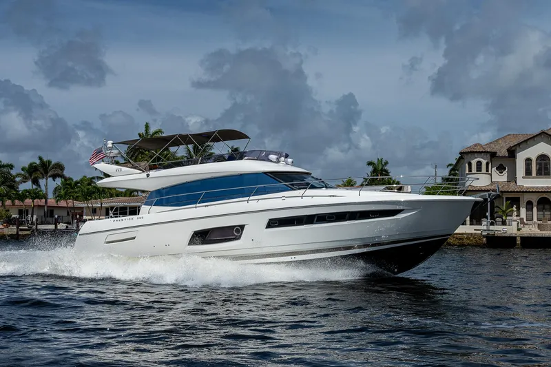 Slide: The Image of Luxury 2014 Prestige 550 yacht cruising near waterfront homes. - 38