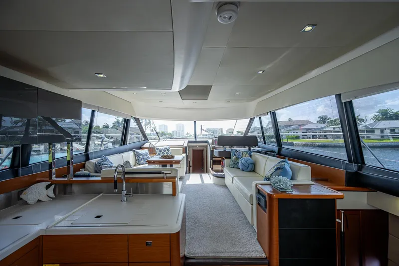 Slide: The Image of Luxurious interior of a 2014 Prestige 550 yacht with modern furnishings and panoramic windows. - 45