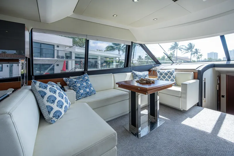Slide: The Image of Luxurious interior of 2014 Prestige 550 yacht with elegant seating and decorative pillows. - 46