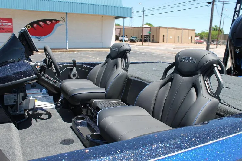Slide: The Image of 2025 Skeeter ZXR20 boat interior with sleek black seats and modern dashboard. - 6
