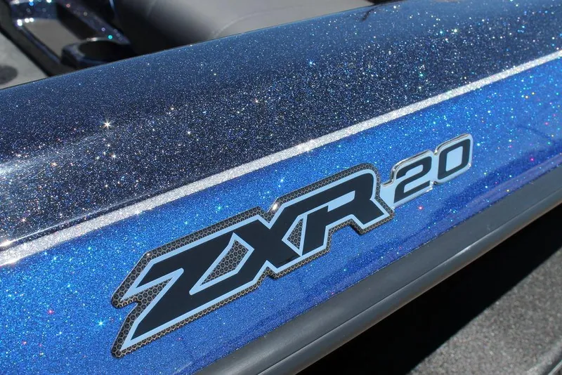 Slide: The Image of 2025 Skeeter ZXR20 boat with sparkling blue finish and bold logo. - 7
