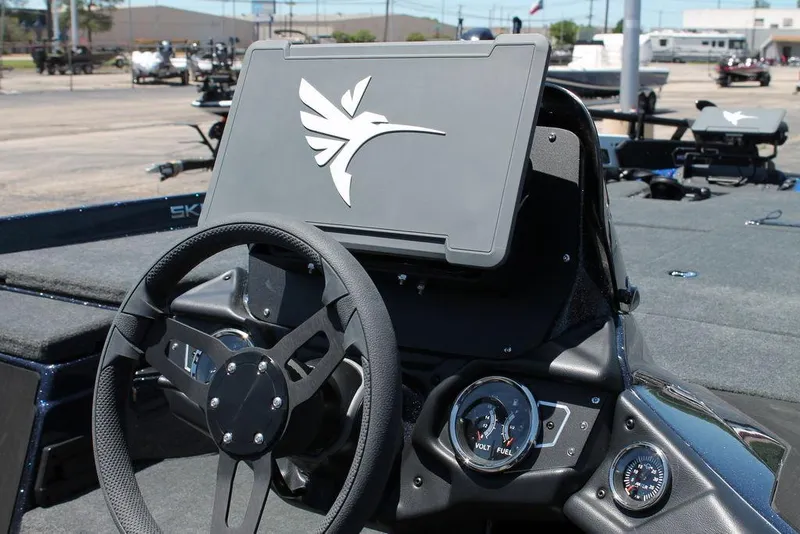 Slide: The Image of 2025 Skeeter ZXR20 boat dashboard with steering wheel and instrument panel. - 8