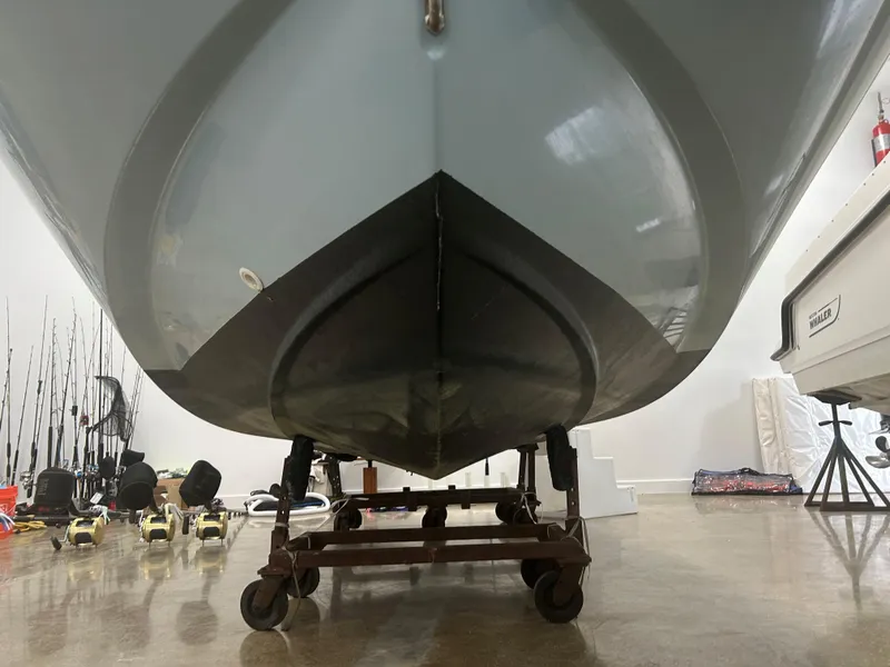 Slide: The Image of 2020 Boston Whaler 160 Super Sport boat hull on a dolly in a garage. - 8