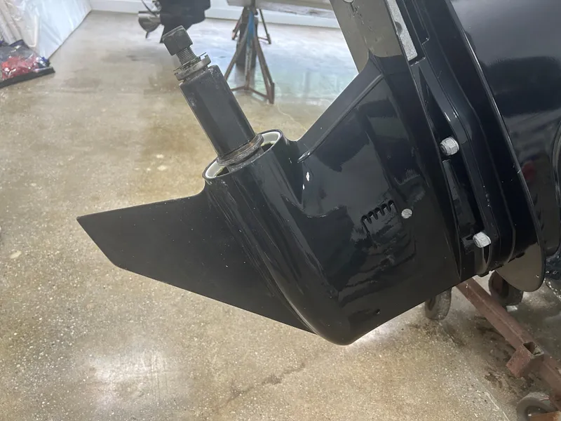 Slide: The Image of Outboard motor detail of 2020 Boston Whaler 160 Super Sport in a workshop setting. - 9