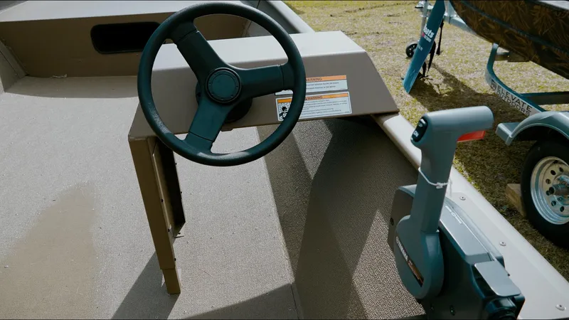 Slide: The Image of Steering wheel and controls of 2025 G3 1860VBW boat, featuring modern design and functionality. - 1