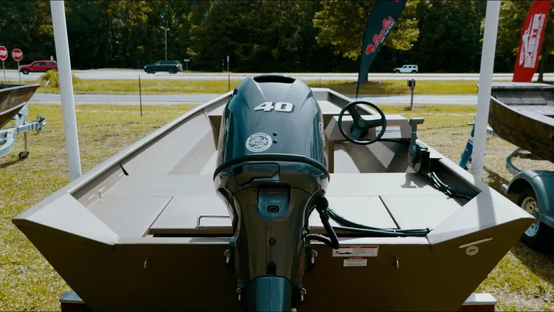 Slide: The Image of 2025 G3 1860VBW boat with 40HP motor displayed outdoors. - 2