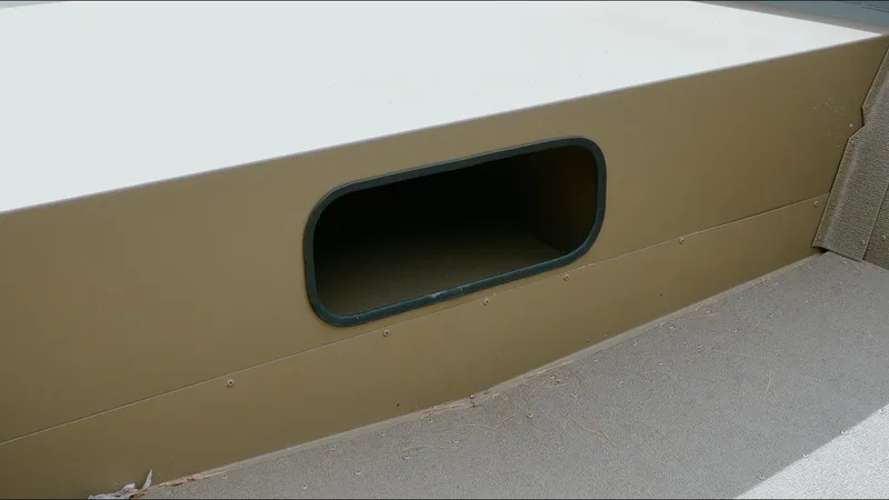 Slide: The Image of Storage compartment on a 2025 G3 1860VBW boat, featuring an oval opening. - 3