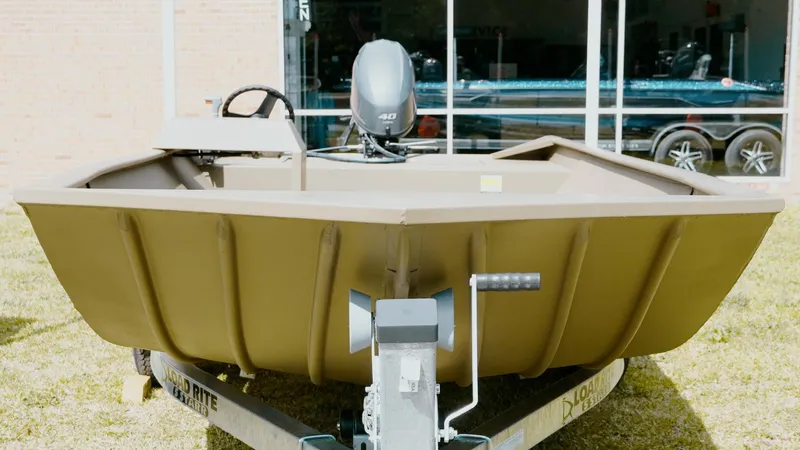 Slide: The Image of 2025 G3 1860VBW boat on trailer, front view, outdoors. - 4