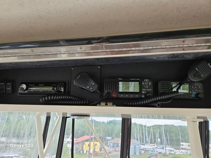 Slide: The Image of Control panel of a 1991 Viking 45 Convertible boat with communication equipment. - 34