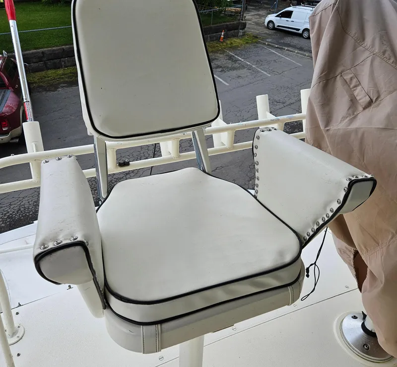 Slide: The Image of White captain's chair on a 1991 Viking 45 Convertible boat deck. - 35