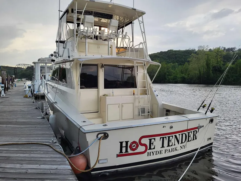 Slide: The Image of 1991 Viking 45 Convertible boat docked, labeled "Hose Tender," Hyde Park, NY. - 39