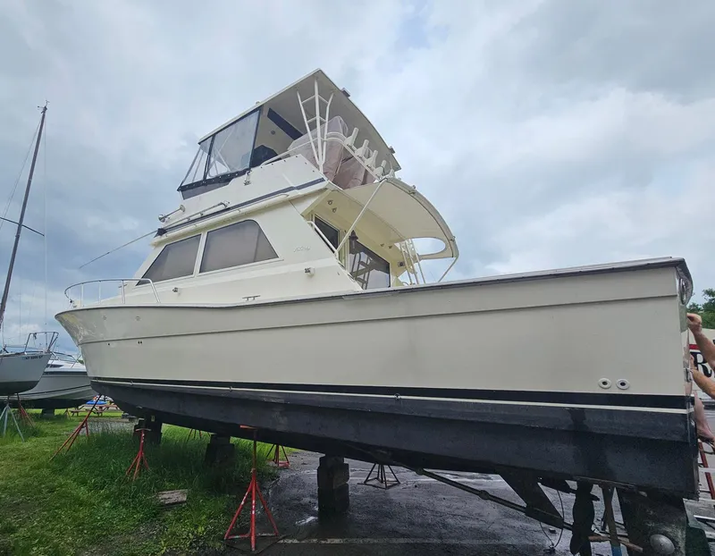 Slide: The Image of 1991 Viking 45 Convertible yacht on stands, cloudy sky background. - 45