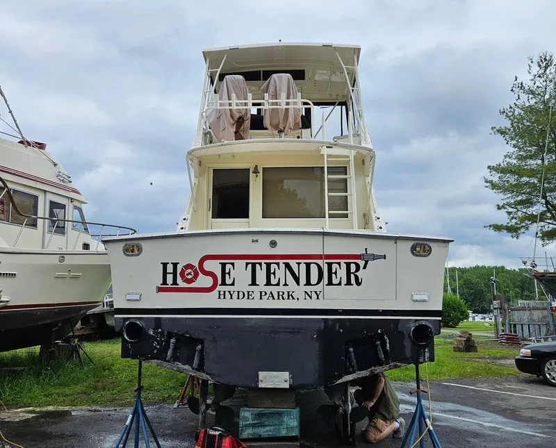 Slide: The Image of Viking 45 Convertible 1991 boat named "Hose Tender" in Hyde Park, NY, on land. - 46
