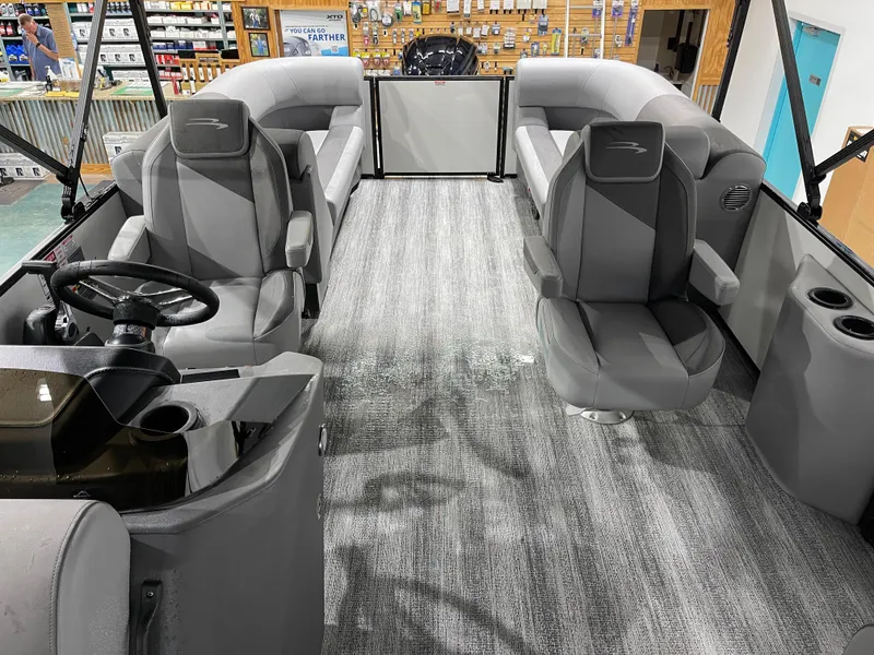 Slide: The Image of 2025 Bennington 25SSRSE boat interior with gray seating and modern design. - 14