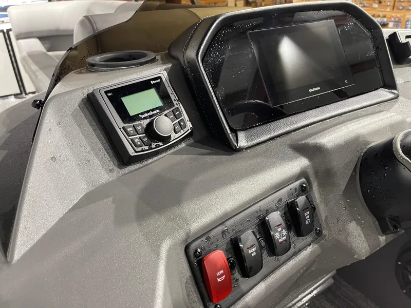 Slide: The Image of 2025 Bennington 25SSRSE dashboard with Garmin display and Rockford Fosgate audio system. - 21