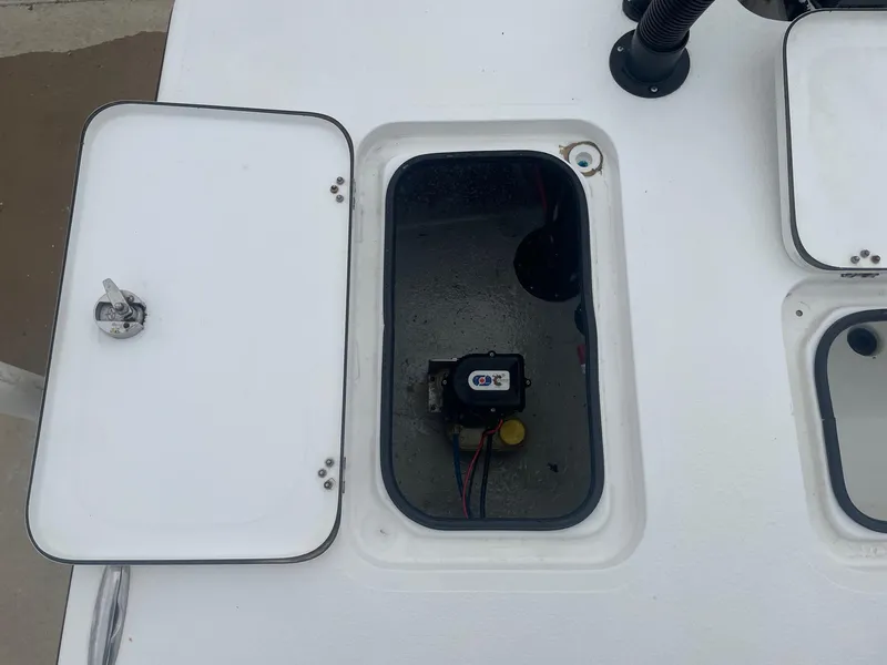 Slide: The Image of Open hatch on 2013 Majek 22 XTREME boat deck, revealing internal compartment. - 11