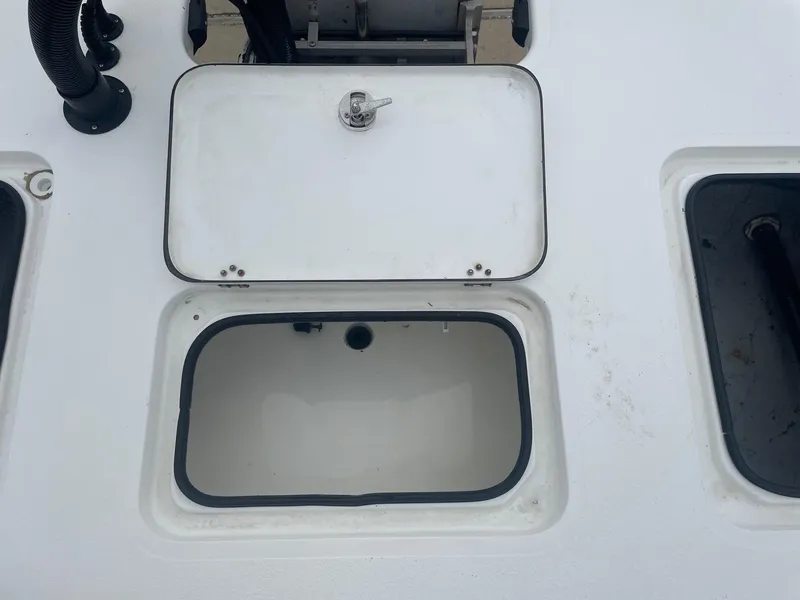 Slide: The Image of Open storage compartment on a 2013 Majek 22 XTREME boat deck. - 12
