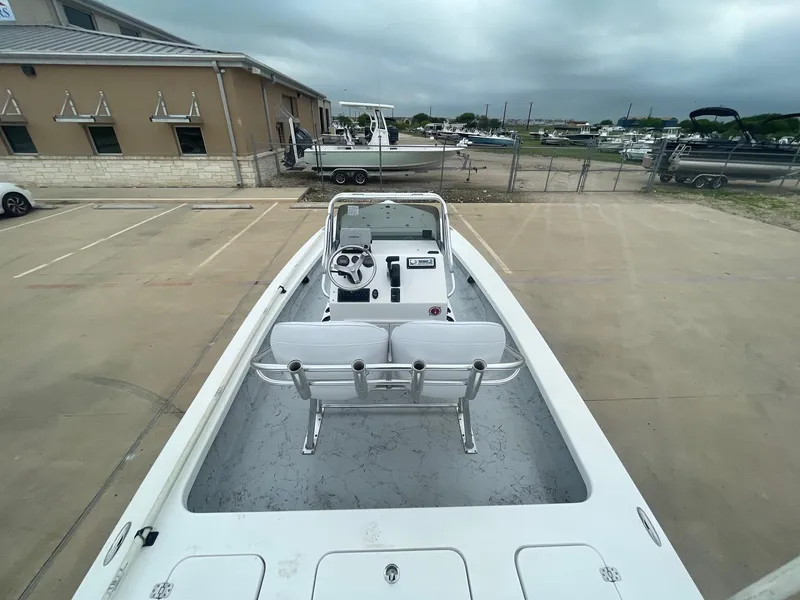Slide: The Image of 2013 Majek 22 XTREME boat in a parking lot, showcasing its interior and steering console. - 15