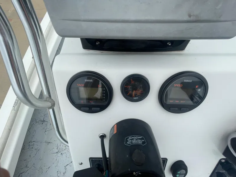 Slide: The Image of Dashboard of a 2013 Majek 22 XTREME boat with Yamaha gauges and controls. - 20