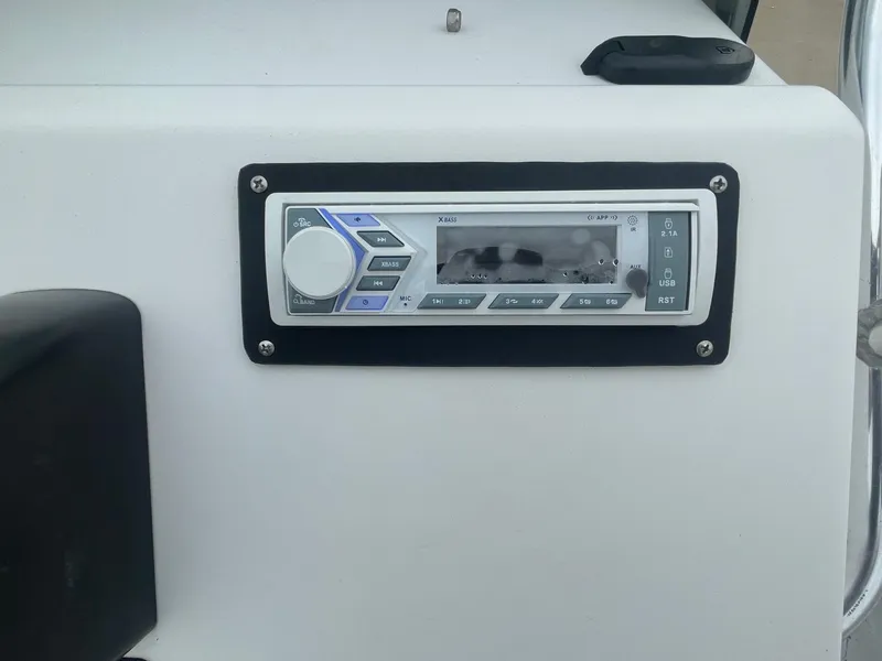 Slide: The Image of Boat stereo system on a 2013 Majek 22 XTREME dashboard. - 22