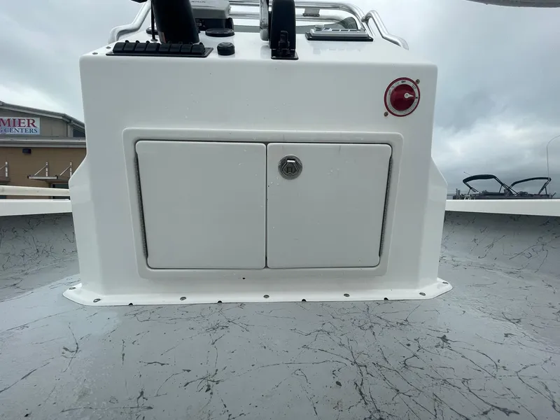 Slide: The Image of 2013 Majek 22 XTREME boat console with storage compartment and control panel. - 25