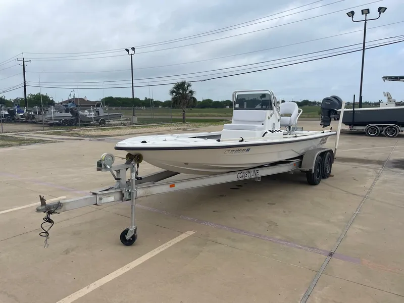 Slide: The Image of 2013 Majek 22 XTREME boat on trailer in parking lot, overcast sky. - 3