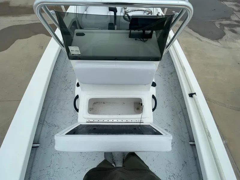 Slide: The Image of 2013 Majek 22 XTREME boat interior with open storage compartment and console. - 32