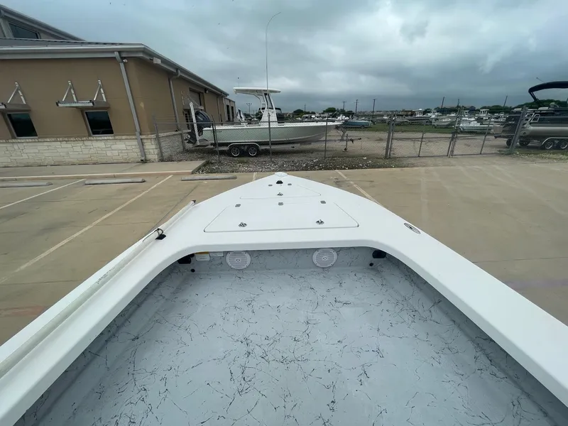 Slide: The Image of 2013 Majek 22 XTREME boat parked in a marina with overcast skies. - 34