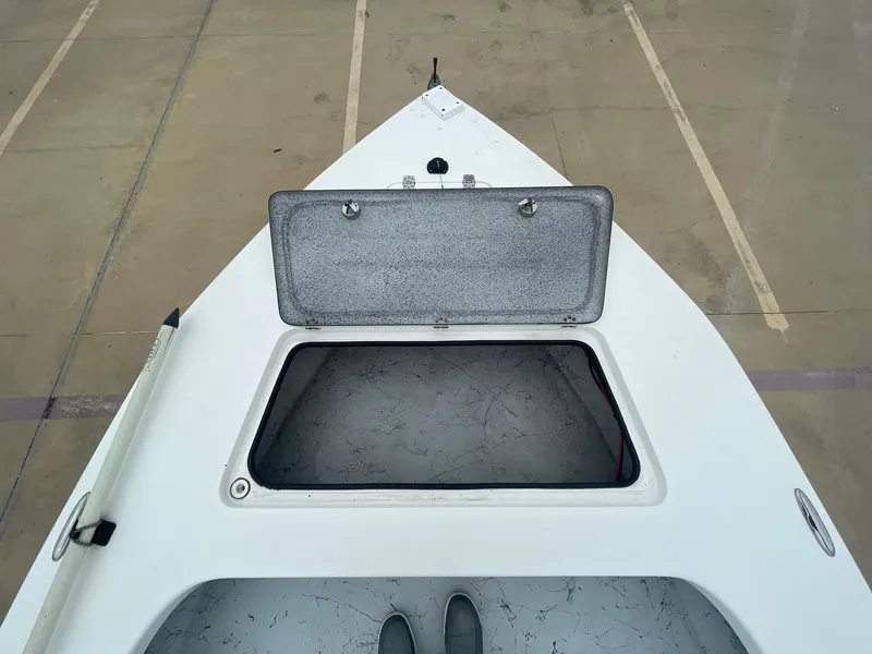 Slide: The Image of 2013 Majek 22 XTREME boat with open storage compartment on deck. - 35