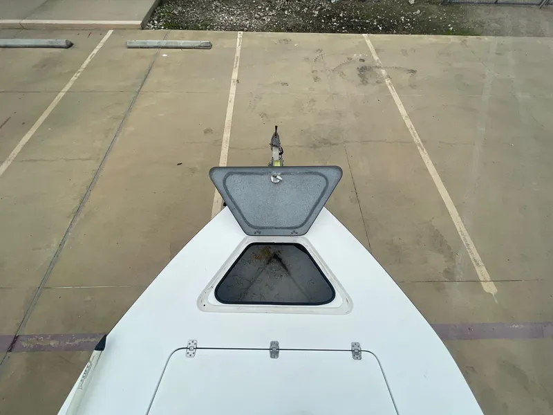 Slide: The Image of 2013 Majek 22 XTREME boat with open hatch in parking lot. - 36