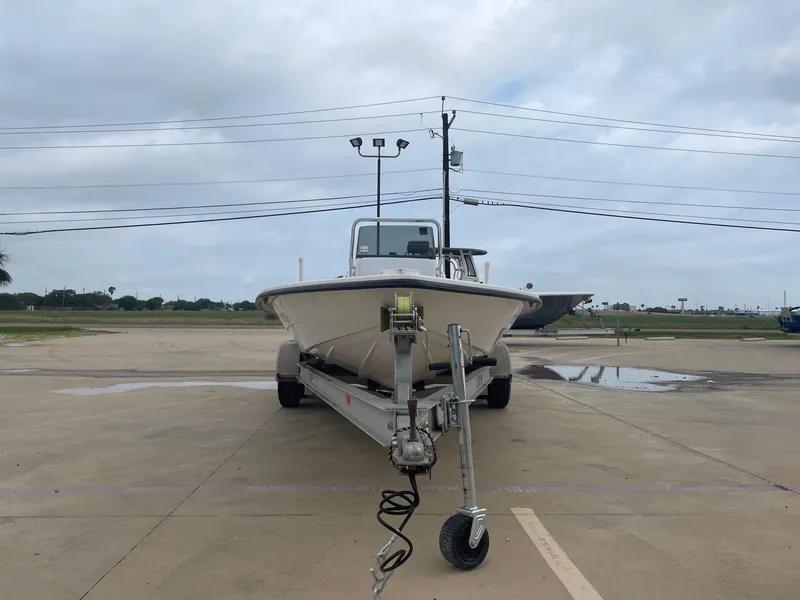 Slide: The Image of 2013 Majek 22 XTREME boat on trailer in parking lot, cloudy sky background. - 5