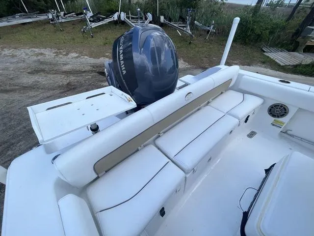 Slide: The Image of 2015 Sportsman Heritage 211 boat with Yamaha engine, featuring white seating and spacious deck. - 11