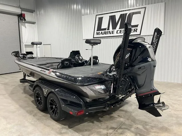 Slide: The Image of 2025 Skeeter FXR21L bass boat in showroom, featuring sleek design and powerful engine. - 4