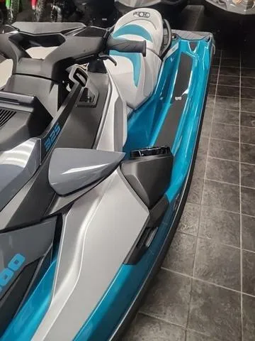 Slide: The Image of 2025 Sea-Doo Waverunner GTX in showroom, featuring sleek blue and gray design. - 8