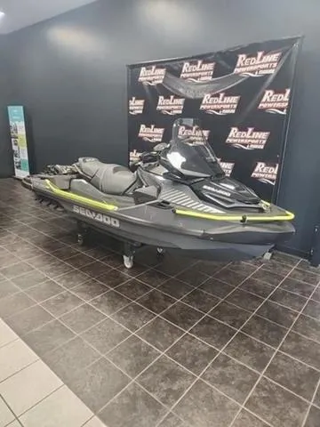 Slide: The Image of 2025 Sea-Doo Waverunner Explorer Pro on display in showroom with branded backdrop. - 1