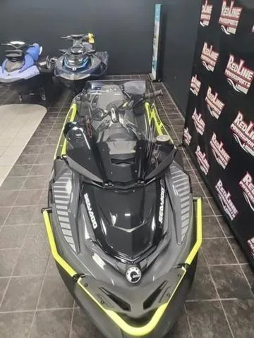 Slide: The Image of 2025 Sea-Doo Waverunner Explorer Pro displayed in showroom with sleek design and vibrant accents. - 12