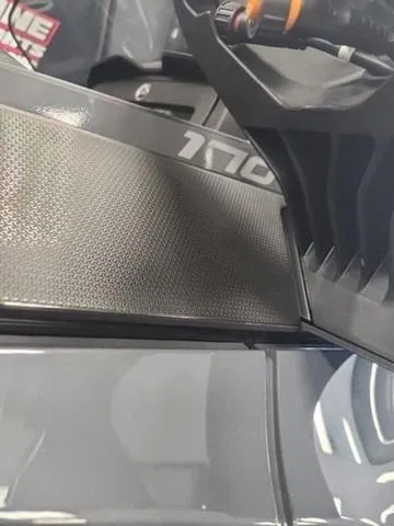 Slide: The Image of 2025 Sea-Doo Waverunner Explorer Pro, close-up of sleek design and textured surface. - 13