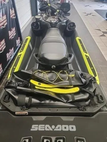 Slide: The Image of 2025 Sea-Doo Waverunner Explorer Pro, black and yellow, displayed indoors. - 7