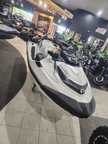 Slide: The Image of 2025 Sea-Doo Waverunner GTX displayed in a showroom with other vehicles. - 8