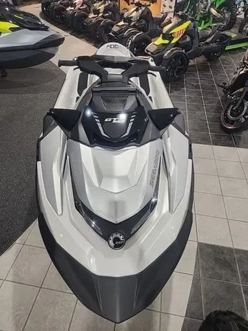 Slide: The Image of 2025 Sea-Doo Waverunner GTX in showroom, sleek design, white and black color scheme. - 9