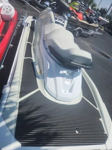 Slide: The Image of 2025 Yamaha WaveRunner VX Cruiser HO in a showroom, showcasing sleek design and seating. - 9