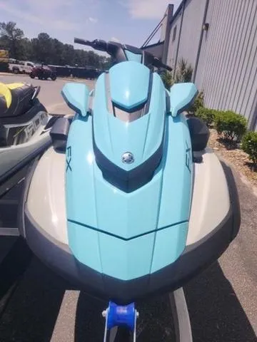 Slide: The Image of 2025 Yamaha WaveRunner FX Cruiser HO in light blue, parked outdoors. - 7