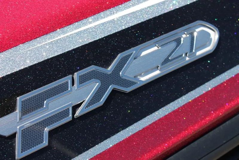 Slide: The Image of 2019 Skeeter FX21 LE boat emblem with metallic red and silver detailing. - 6