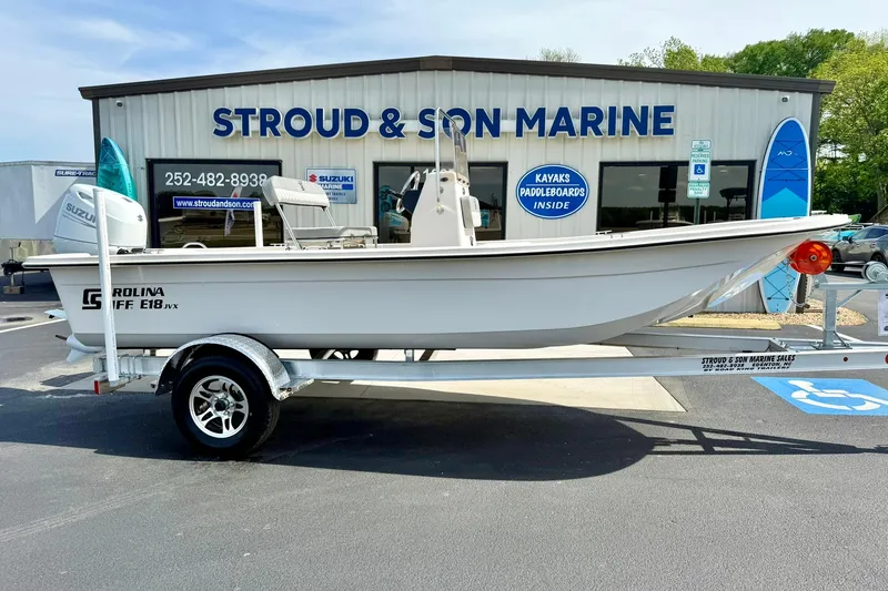 Slide: The Image of 2025 Carolina Skiff E18 JVX CC boat on trailer at Stroud & Son Marine dealership. - 30